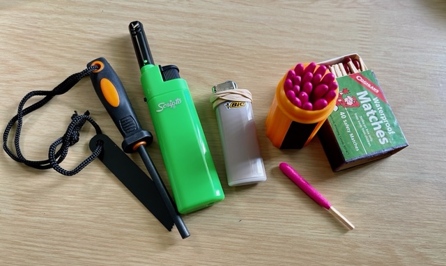 Types of fire starters for your fire starter kit: ferro rod, cigarette lighter, regular and fireproof matches. 