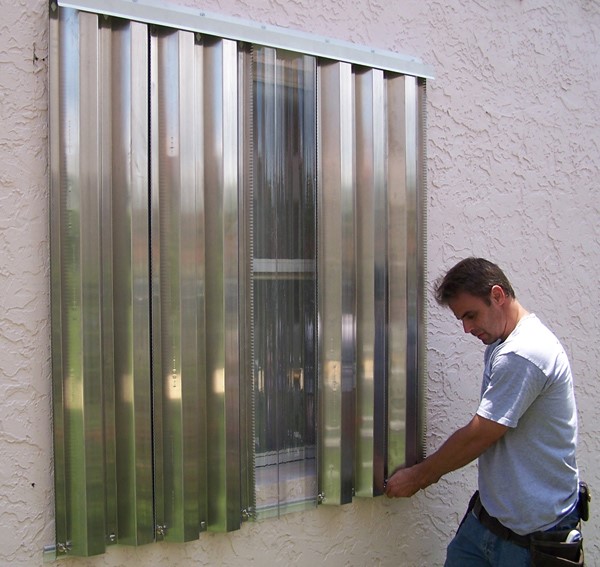 Before a hurricane or tropical storm hits, put up your hurricane shutters. 